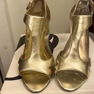Leather gold Nine West heels. Buckle at ankle